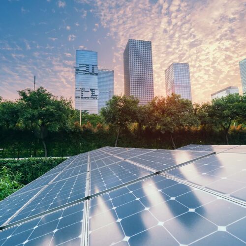 solar panels with view of city in background