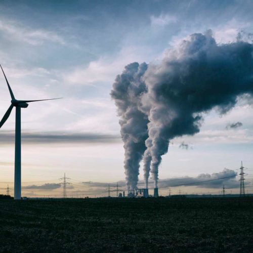 smoke stacks wind turbines